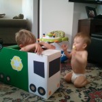 Boys in homemade garbage truck